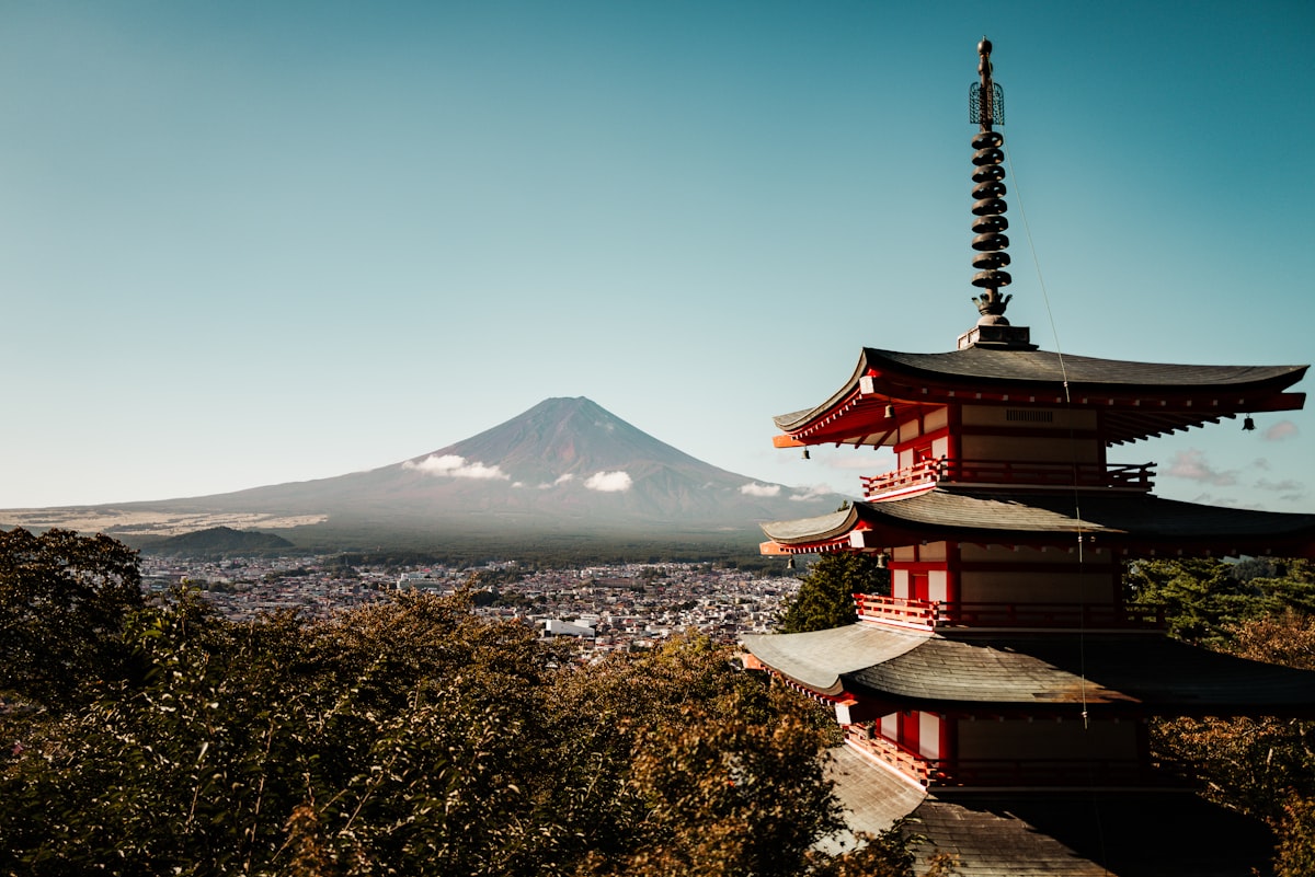 Traditional Japanese pagoda with Mount Fuji in the background