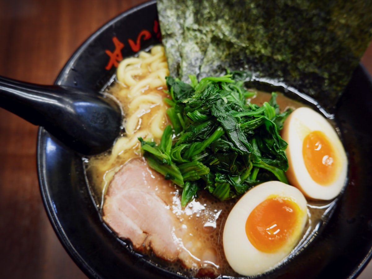 Japanese ramen bowl with soft boiled egg and vegetables