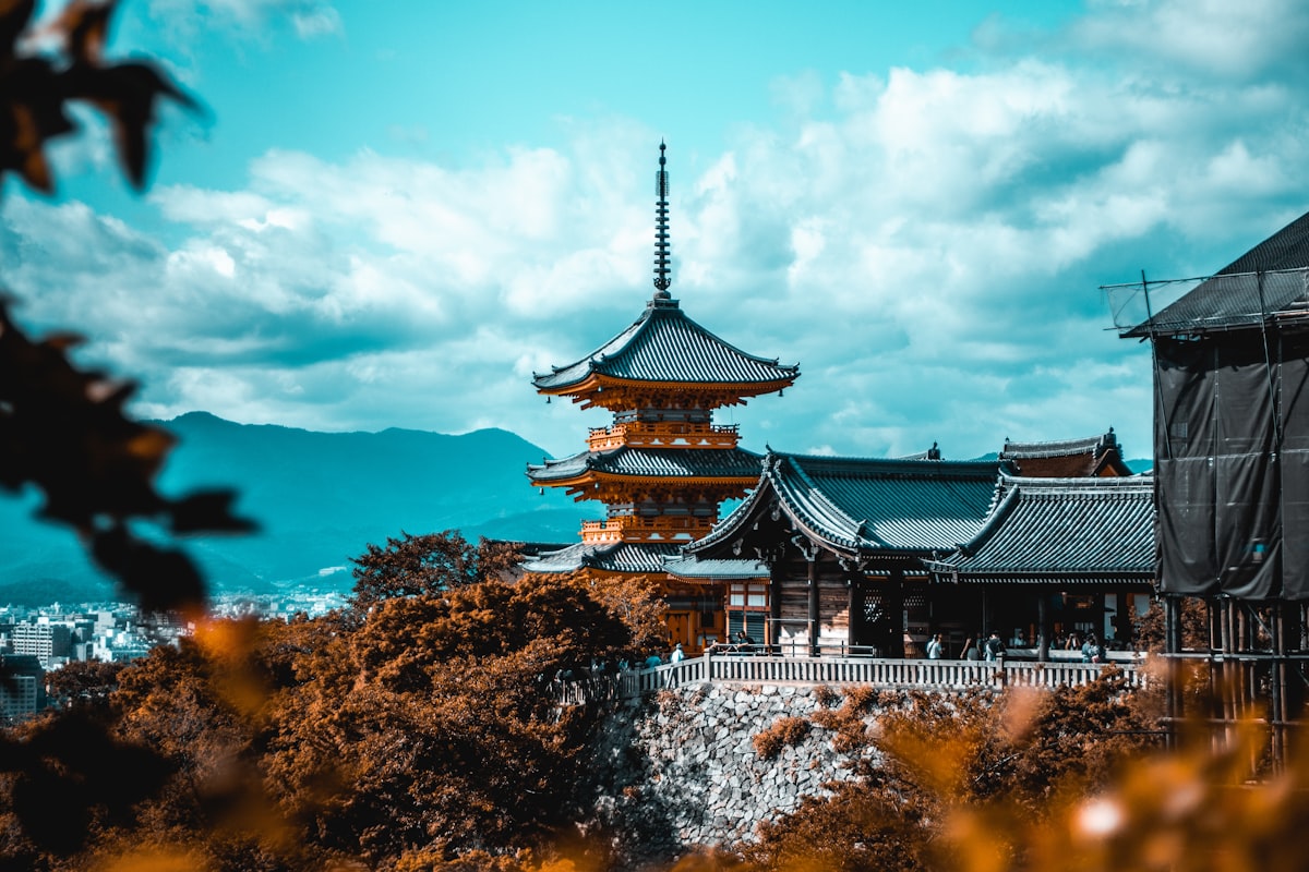 Kyoto temple pagoda surrounded by autumn trees